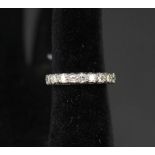 An 18ct gold ring set with nine diamonds,