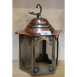 An Arts and Crafts hexagonal brass and copper hanging lantern,