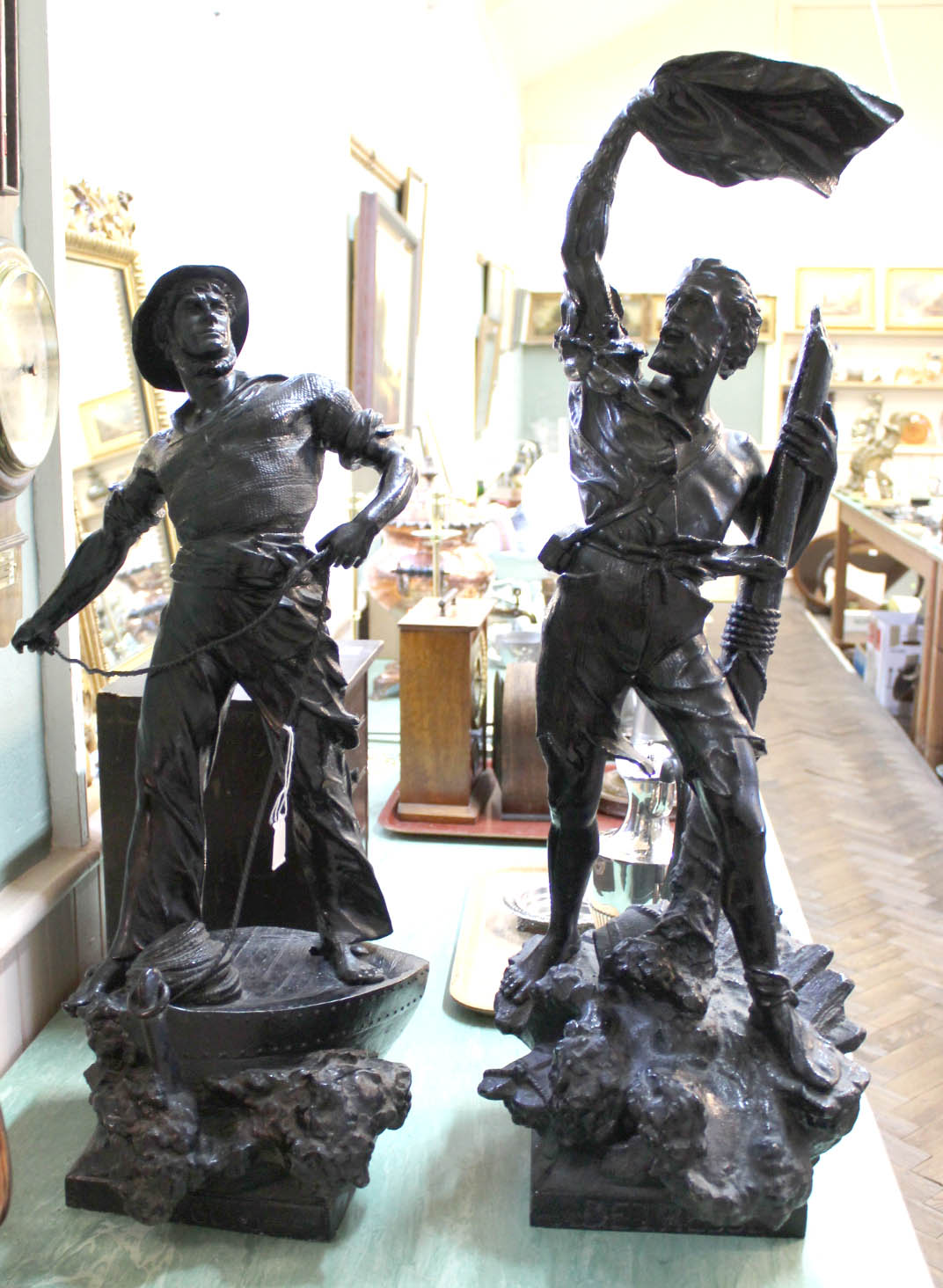 A large matched pair of spelter fishermen,