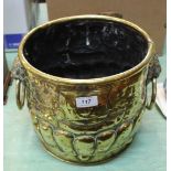 A heavy 19th Century embossed brass jardiniere with gadrooning and lion mask ring handles,