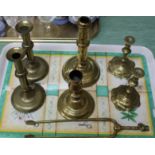 A pair of 18th Century side ejector brass candlesticks plus two singles,