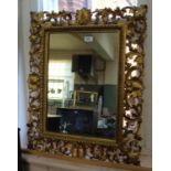 A 19th Century gilt wood foliate wall mirror (replacement glass)