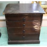 A stained pine four drawer collectors cabinet