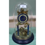 A glass domed anniversary clock