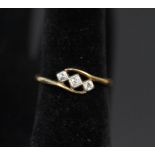 An 18ct gold Art Deco style three stone diamond ring,