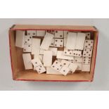 A set of vintage ivory small sized dominoes