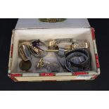 A cigar box, a gents Roamer wristwatch, a lady's Perfex watch, various watch straps,