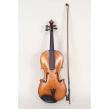 A cased violin and bow,