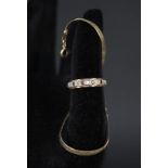 A 9ct gold eternity ring set with garnets and white stones plus a small 9ct gold bracelet