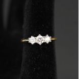 An 18ct gold three stone diamond ring, total diamond weight approx 0.