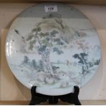 A circular Chinese porcelain figure and landscape plaque,