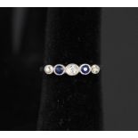 An 18ct gold five stone sapphire and diamond ring,