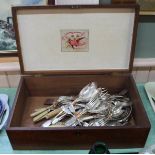 A mahogany box containing silver plated cutlery