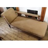 An Edwardian mahogany chaise longue in corded beige upholstery and lyre decorated carved back rest