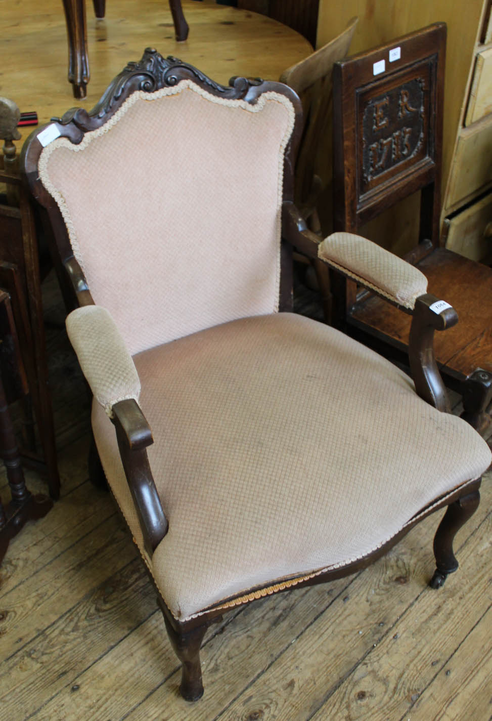 An Edwardian upholstered armchair