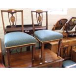 A set of three Edwardian inlaid mahogany upholstered dining chairs