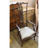 An Edwardian inlaid mahogany high back armchair