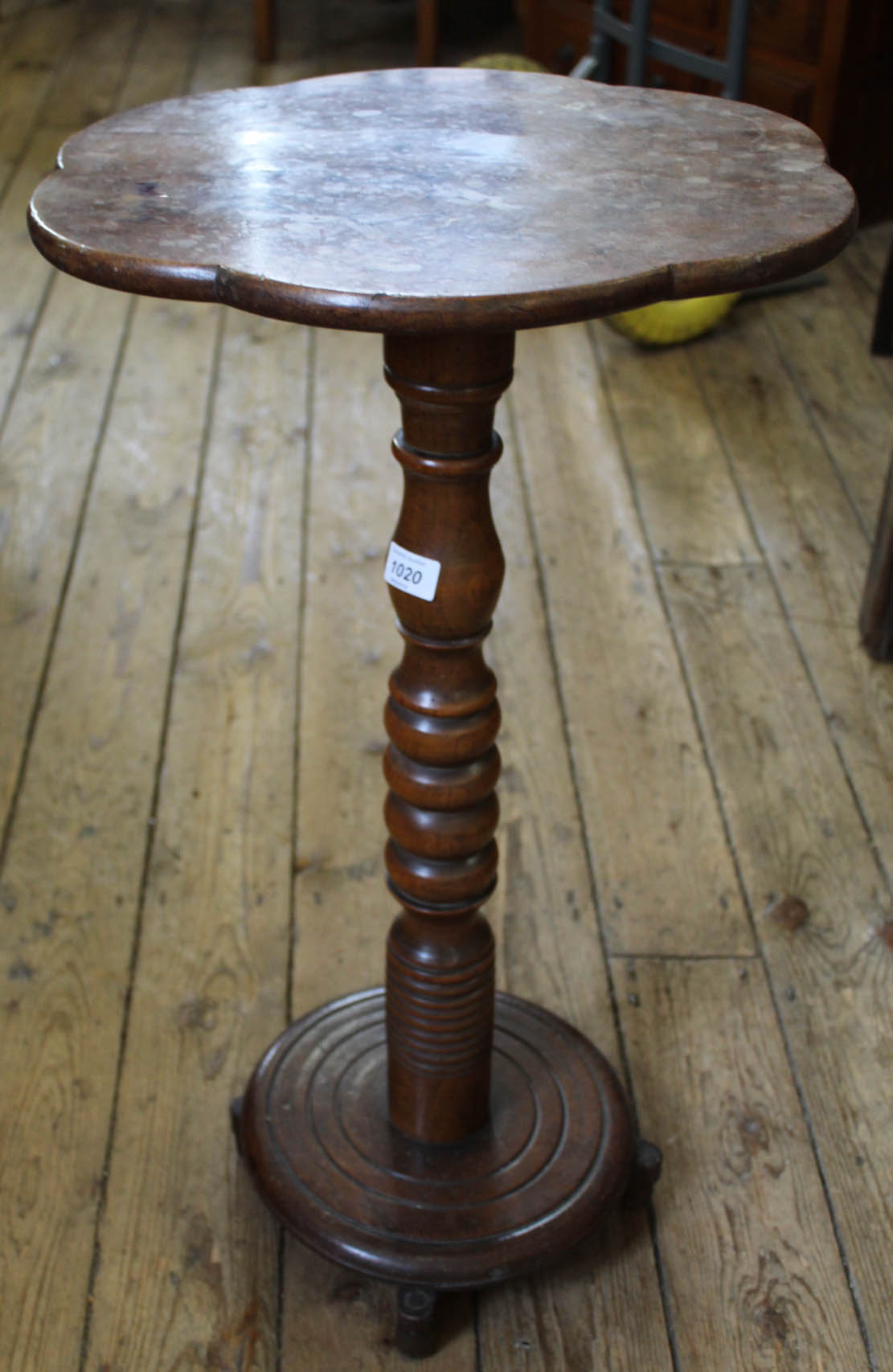 A 19th Century walnut turned column wine table with shaped top