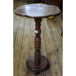 A 19th Century walnut turned column wine table with shaped top