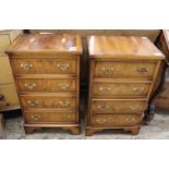 A pair of reproduction four drawer chests