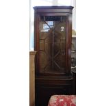 A reproduction mahogany glazed corner cupboard