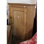 A Victorian pine corner cupboard