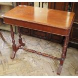 An Edwardian mahogany stretcher base table with single drawer