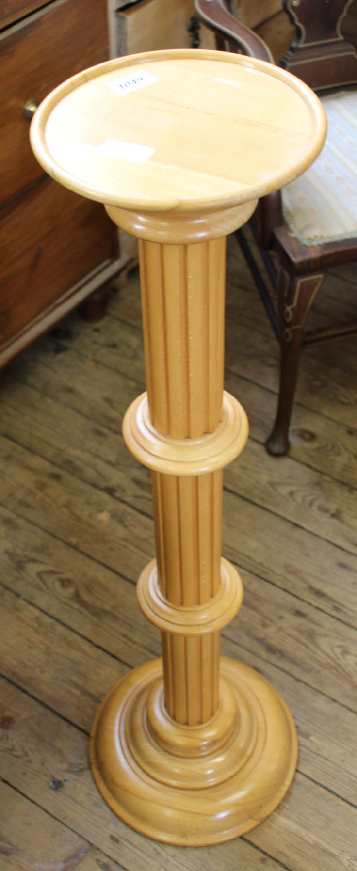 A modern oak style jardiniere stand