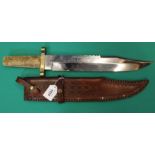 A large Bowie knife with leather scabbard,