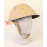 A British WWII M1944 helmet, rear liner support stamped B.M.B.