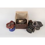 Three WWII era respirators including a childs example