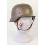 A German (PATTERN) steel helmet with liner