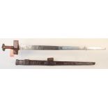 A 19th Century North African/Sudanese sword with embossed leather scabbard (as found)