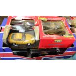 Boxed large scale model cars,