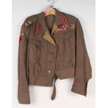 A WWII British Officers battle dress blouse (private purchase) with an impressive display of medal