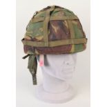 A British 'Kevlar' helmet with camo cover