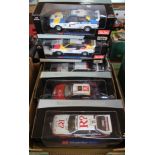 Five boxed large scale rally cars