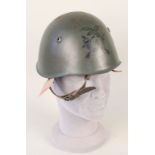 An Italian 1933 model steel helmet with liner