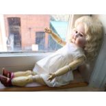 A German bisque head doll marked Special on Victorian jointed wooden body,