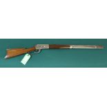 A Winchester model 1886 lever action rifle with a 26" octagonal barrel,