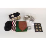 A mixed lot including military badges, insignia,