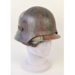 A German WWI era helmet with 'sniper' helmet plate fitted