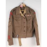 A 1940 patt battle dress blouse dated 1942 complete with Royal Engineers insignia,