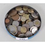 A tin containing GB and foreign coins