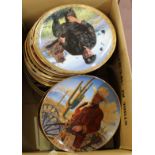 Royal Doulton and other John Wayne collectors plates plus a wall rack