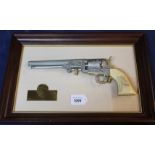 A decorative Colt model 1851 revolver,