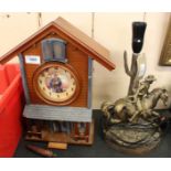 A John Wayne cuckoo clock plus a table lamp