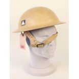 A British WWII era steel helmet, stamps to inside rim 1/1941 B.M.B.