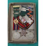 Three WWII medals including an Africa Star with three Safe Driving medallions