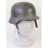 A German (PATTERN) steel helmet with liner